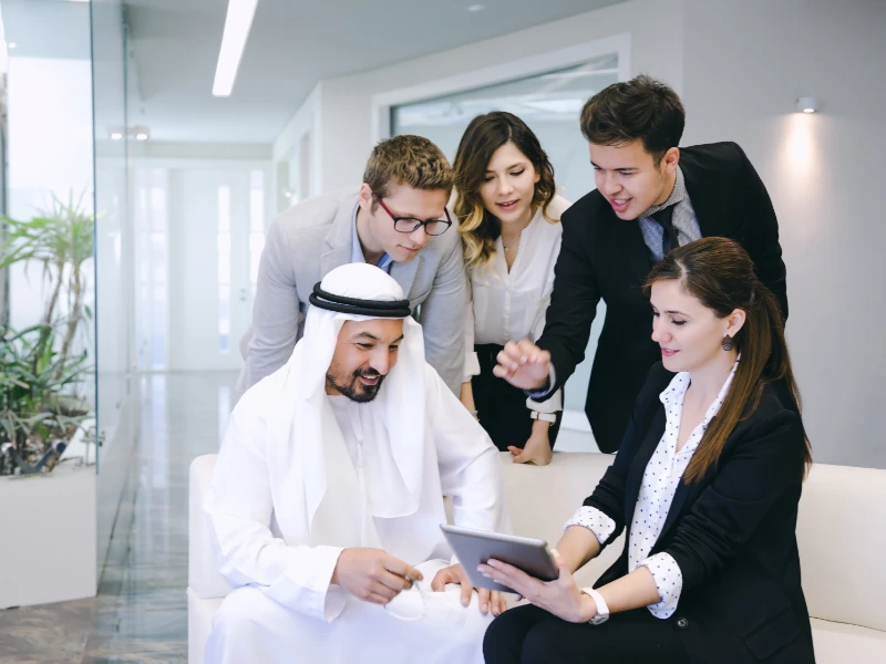 Executive Business team having conversation with a Arab Businessman