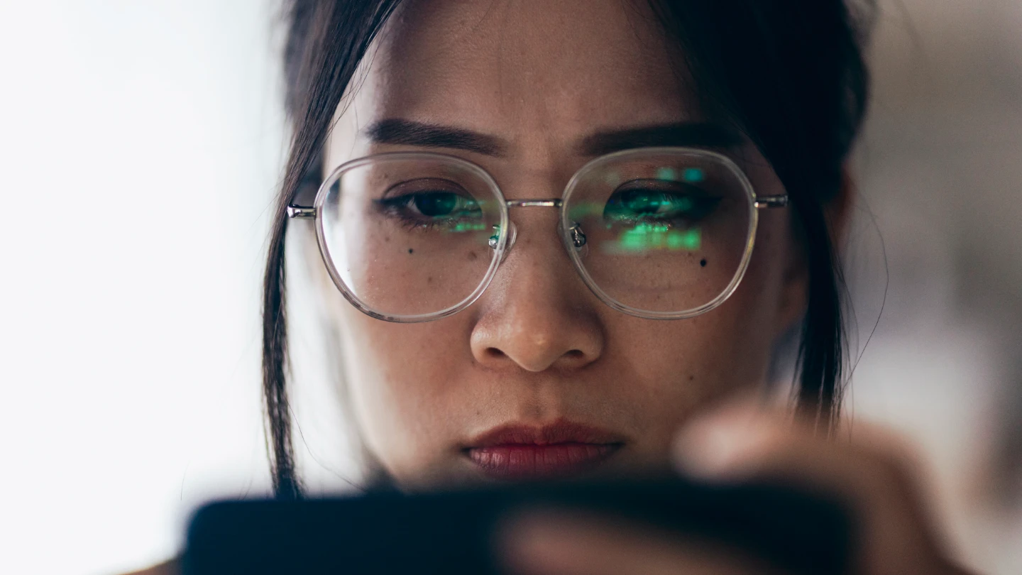Taiwanese lady inspecting her phone