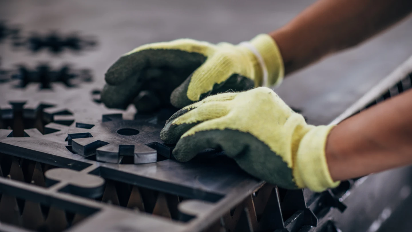 Close up of an engineer forming a metal component