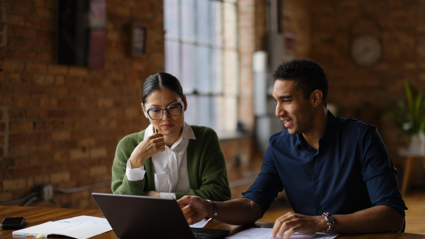 man and woman discussing credit risk